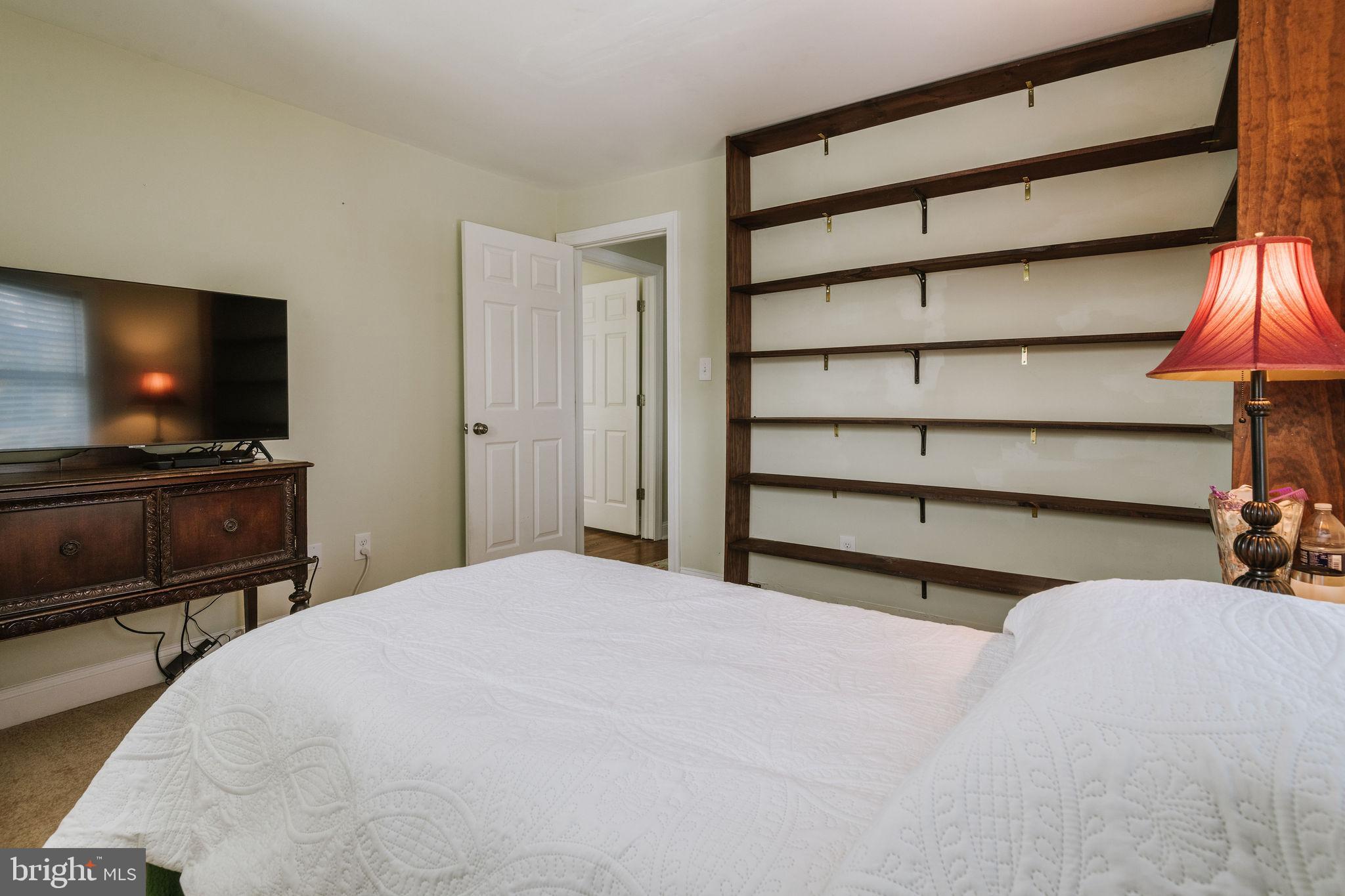 25 North Rolling Road Springfield, PA 19064 - Photo 39 of 45 a bedroom with a bed and a flat screen tv