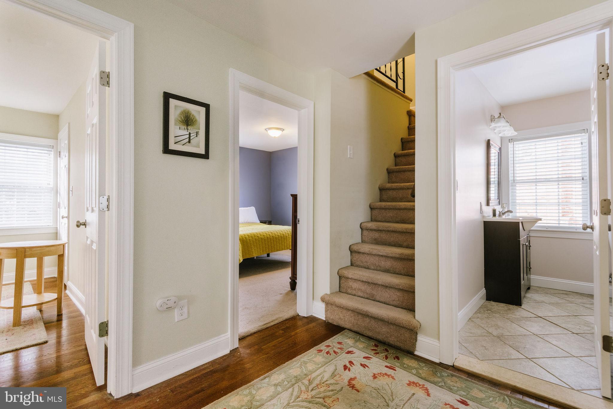 25 North Rolling Road Springfield, PA 19064 - Photo 40 of 45 a view of a hallway with wooden floor and entryway