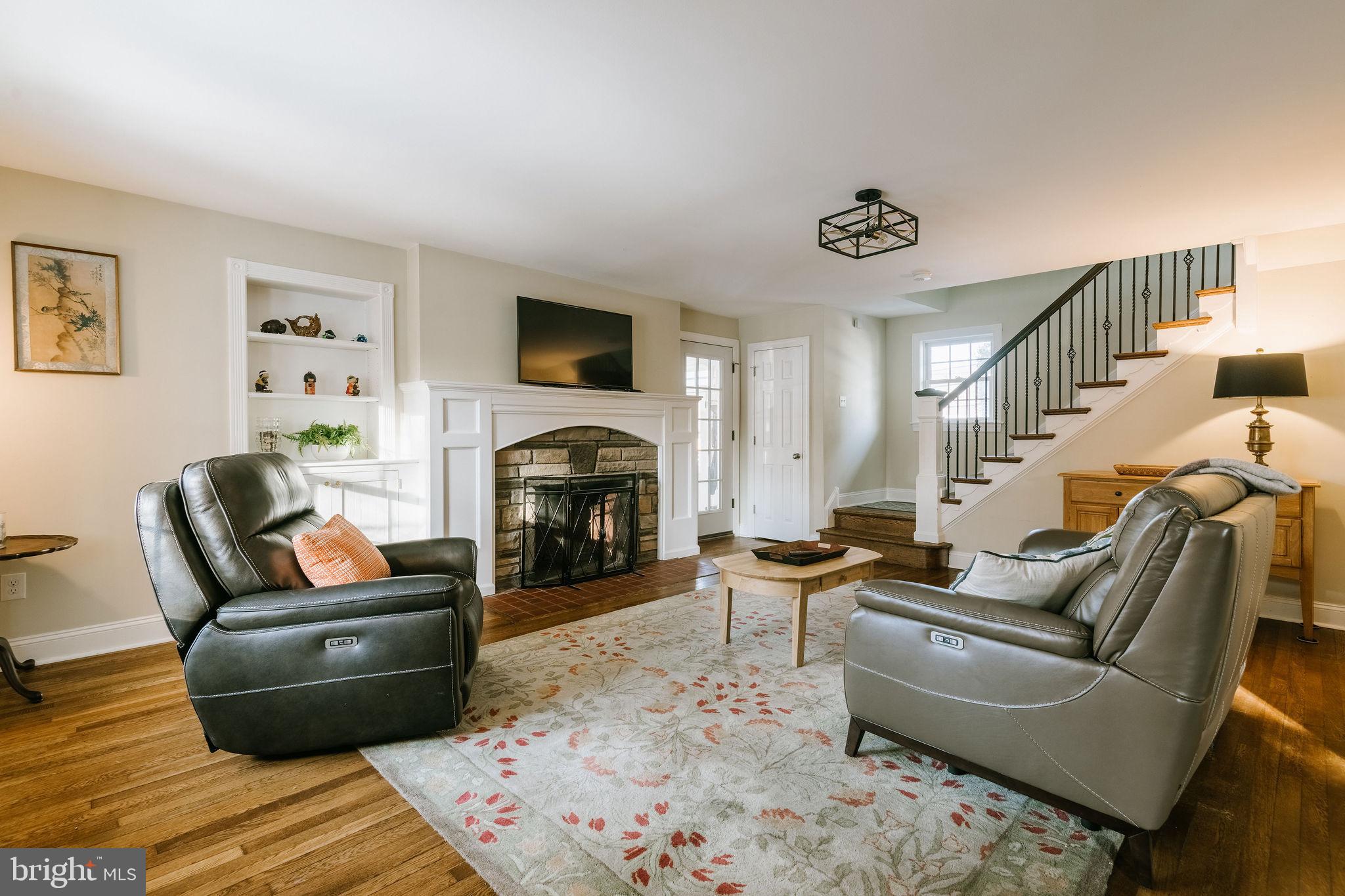 25 North Rolling Road Springfield, PA 19064 - Photo 4 of 45 a living room with furniture and a fireplace