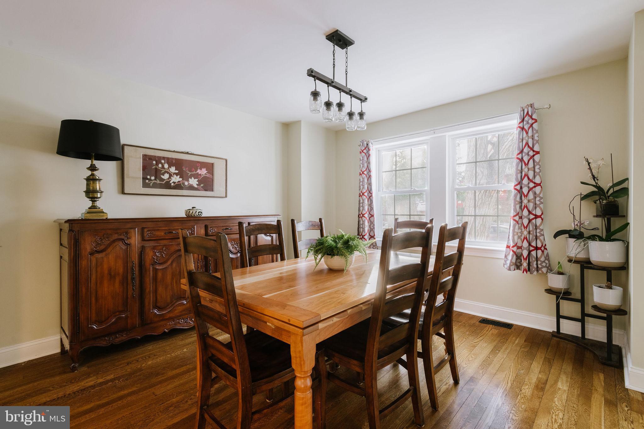 25 North Rolling Road Springfield, PA 19064 - Photo 8 of 45 a view of a dining room with furniture and wooden floor