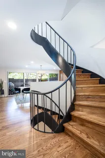 a view of entryway livingroom and hall with wooden floor