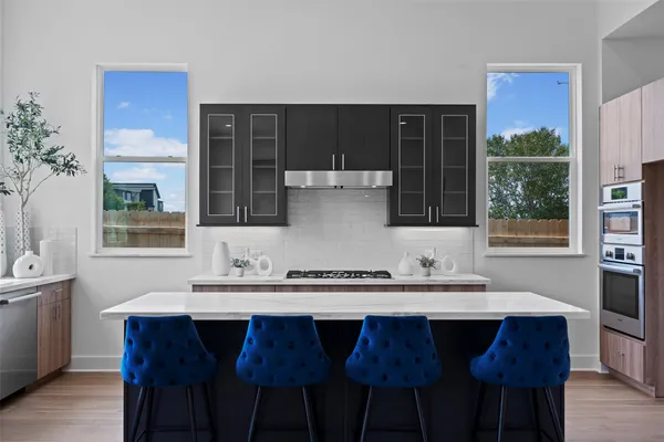 a dining table with chairs and wooden floor