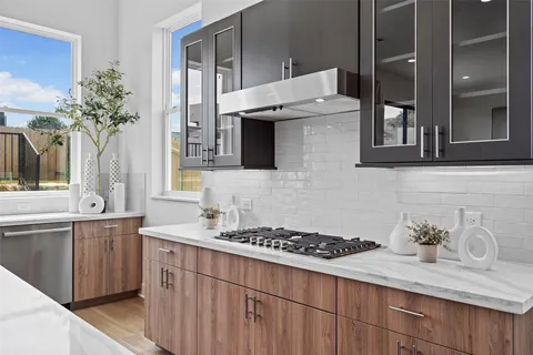 a kitchen with a sink and stove