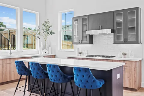 a kitchen with a sink and a refrigerator