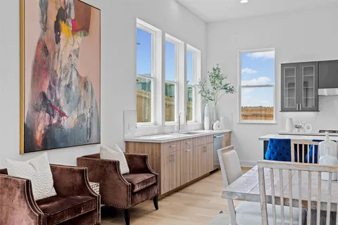 a view of a dining room with furniture window and wooden floor