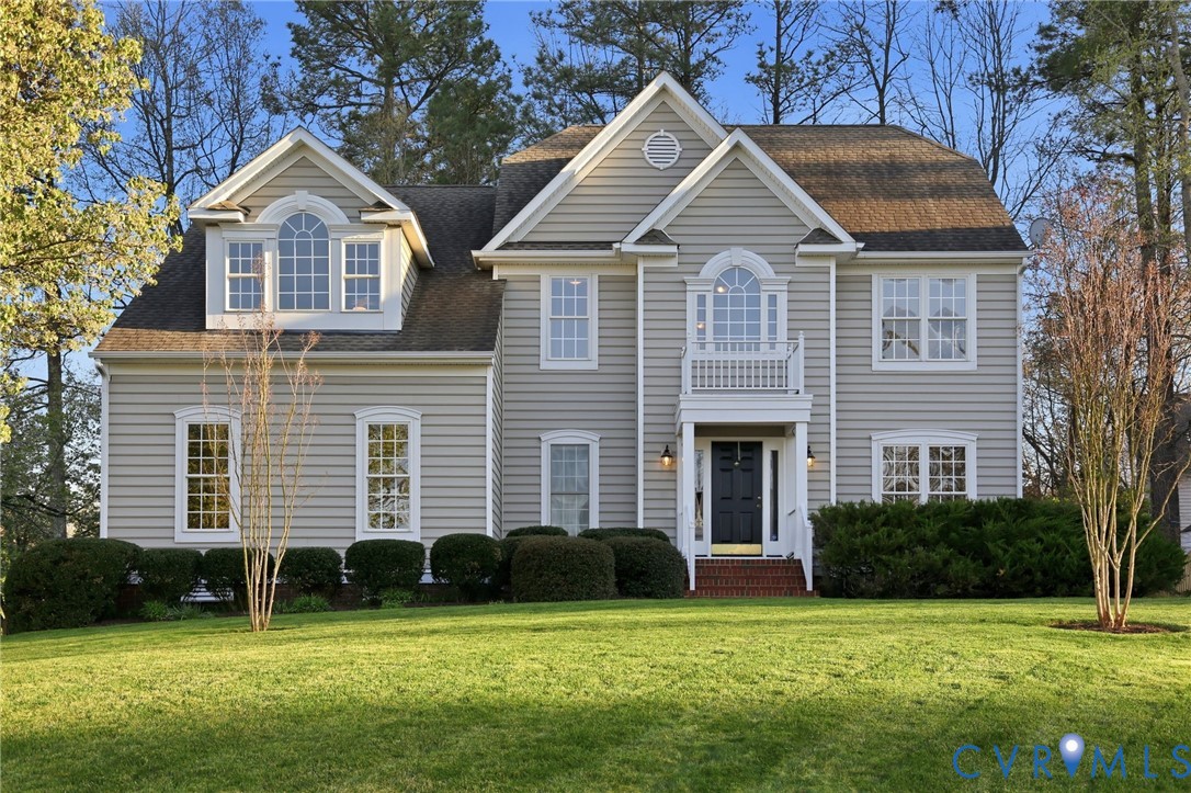 11801 Alder Ridge Place Glen Allen, VA 23059 - Photo 2 of 31 a front view of a house with a garden