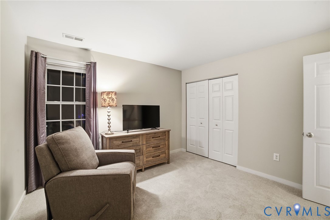 11801 Alder Ridge Place Glen Allen, VA 23059 - Photo 21 of 31 a living room with furniture and a flat screen tv
