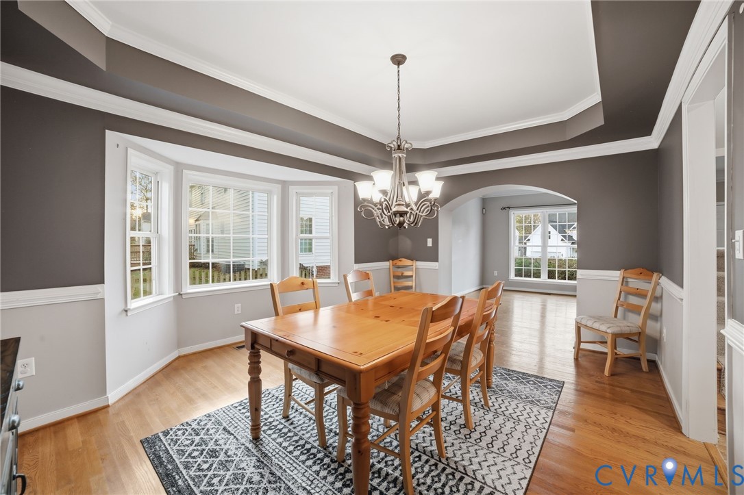 11801 Alder Ridge Place Glen Allen, VA 23059 - Photo 8 of 31 a view of a dining room with furniture window and wooden floor