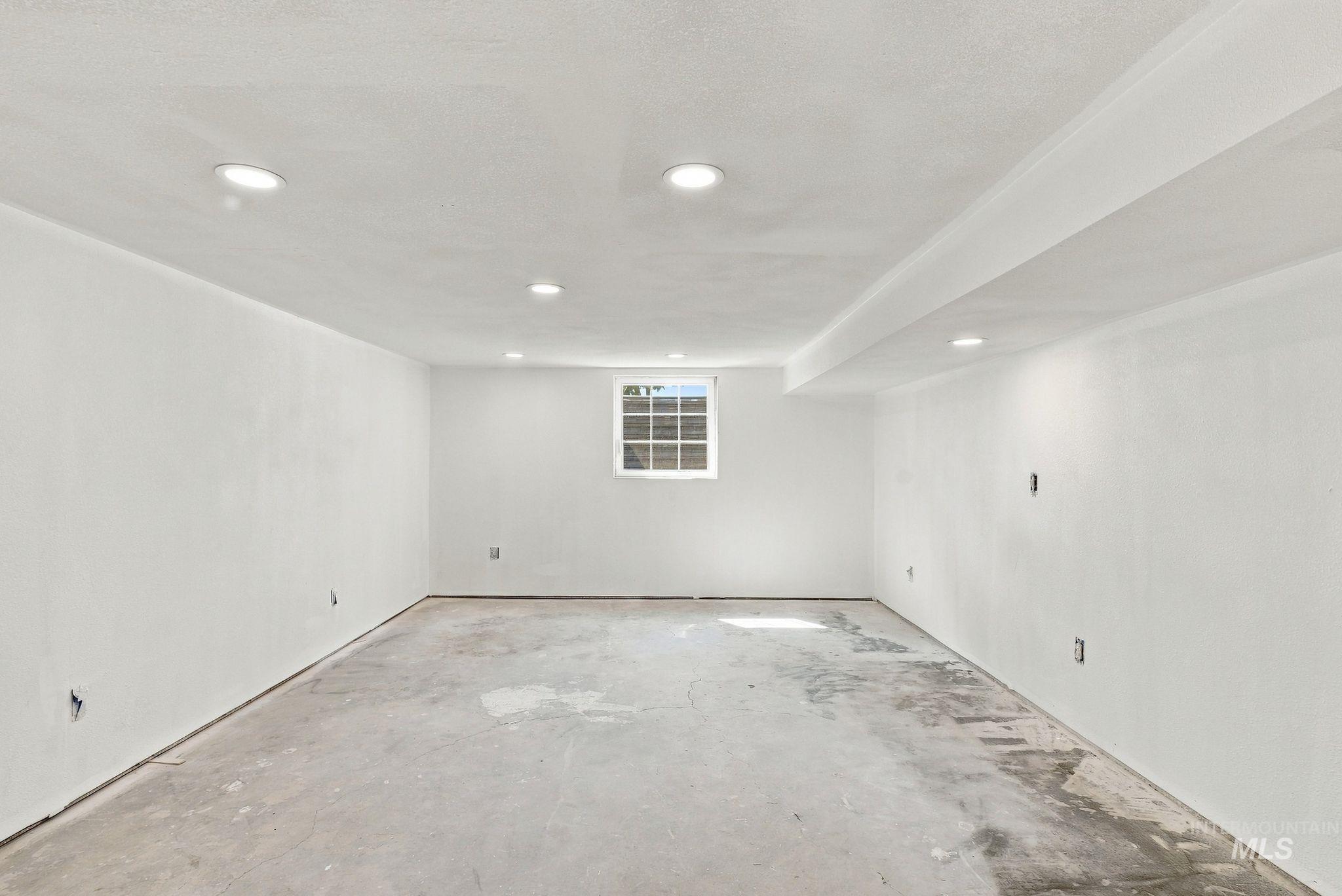 16078 Hoffman Road Kendrick, ID 83537 - Photo 23 of 47 Recessed lighting, painted walls, single window, concrete flooring, exposed ceiling beam