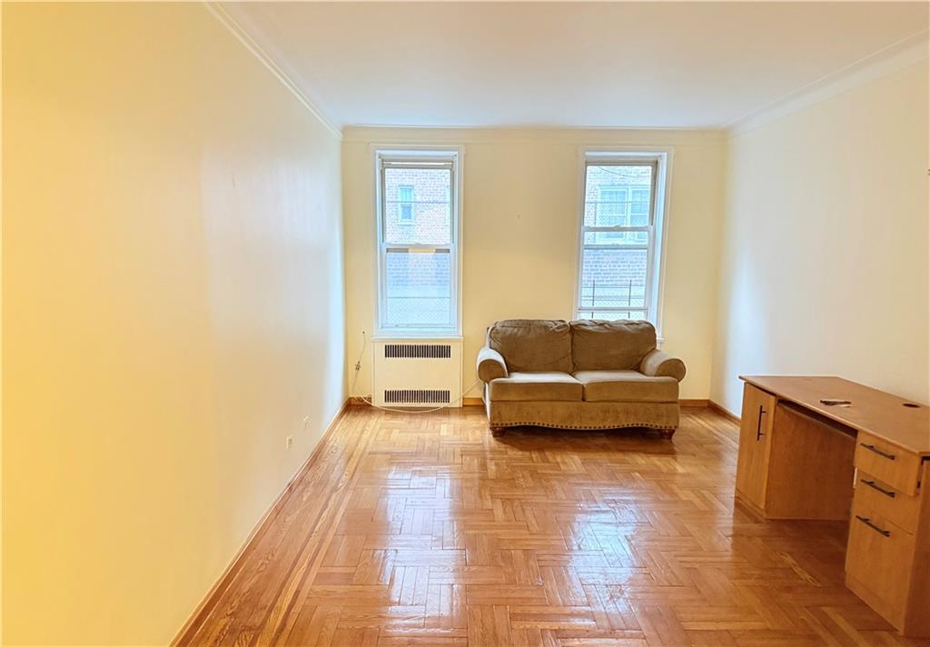 1900 Quentin Road, Unit A15 Brooklyn, NY 11229 - Photo 3 of 8 a living room with furniture and a couch