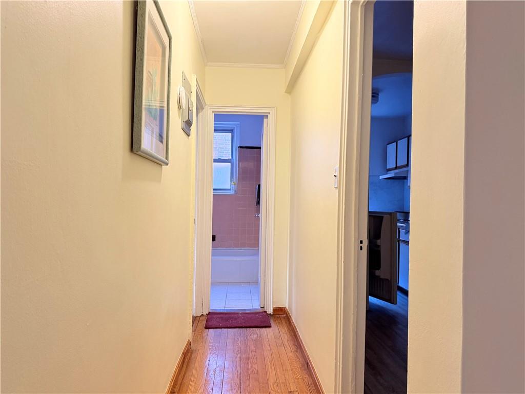 1900 Quentin Road, Unit A15 Brooklyn, NY 11229 - Photo 4 of 8 a view of a hallway with wooden floor and entryway