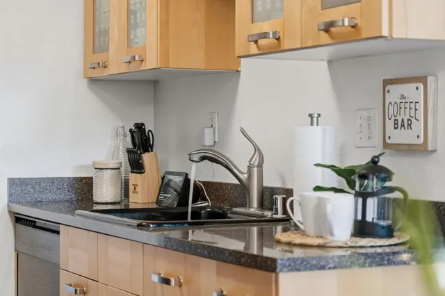 a kitchen with kitchen island a sink a counter and appliances