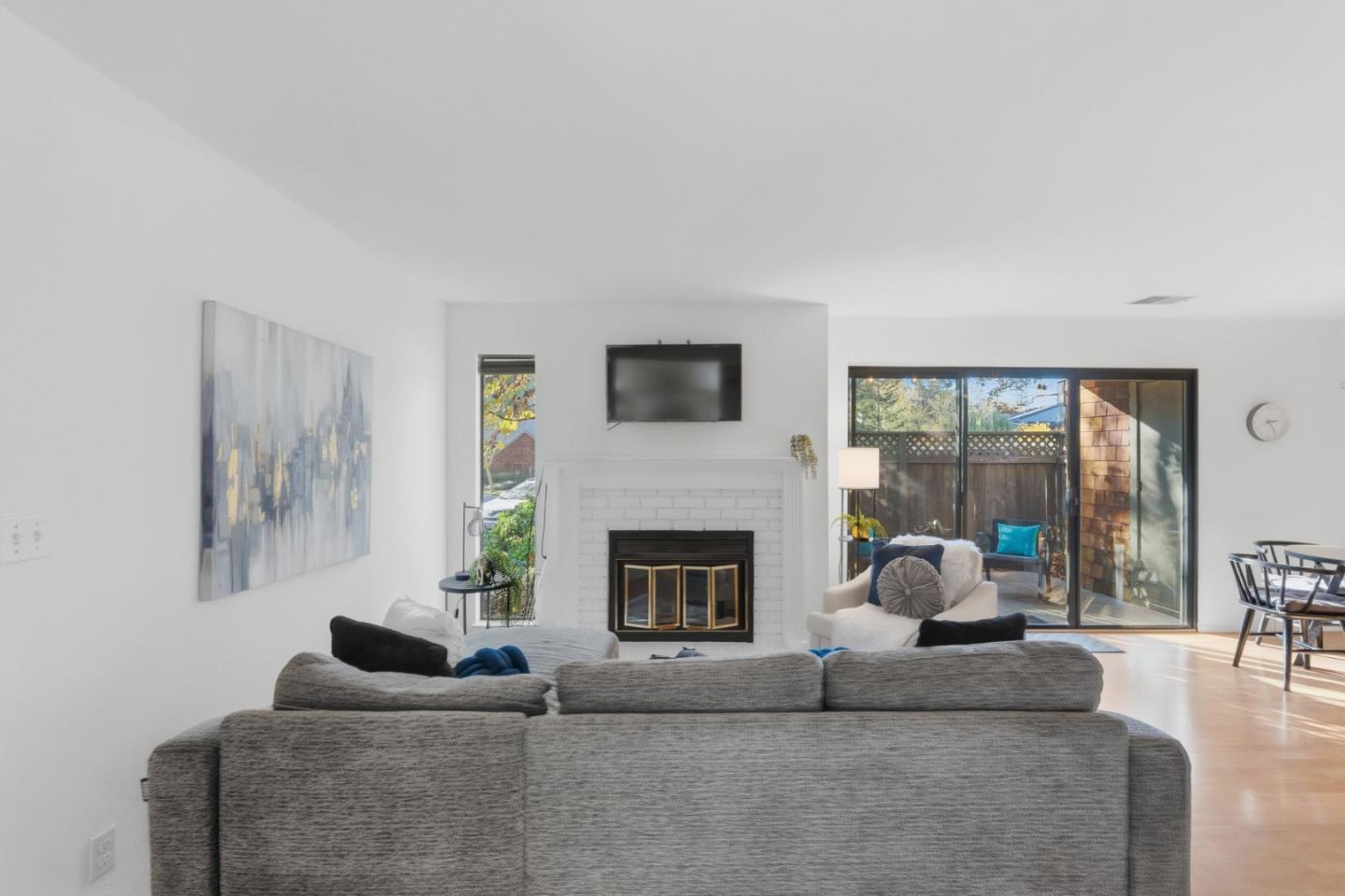 2106 La Terrace Circle San Jose, CA 95123 - Photo 4 of 31 a living room with furniture a fireplace and a large window