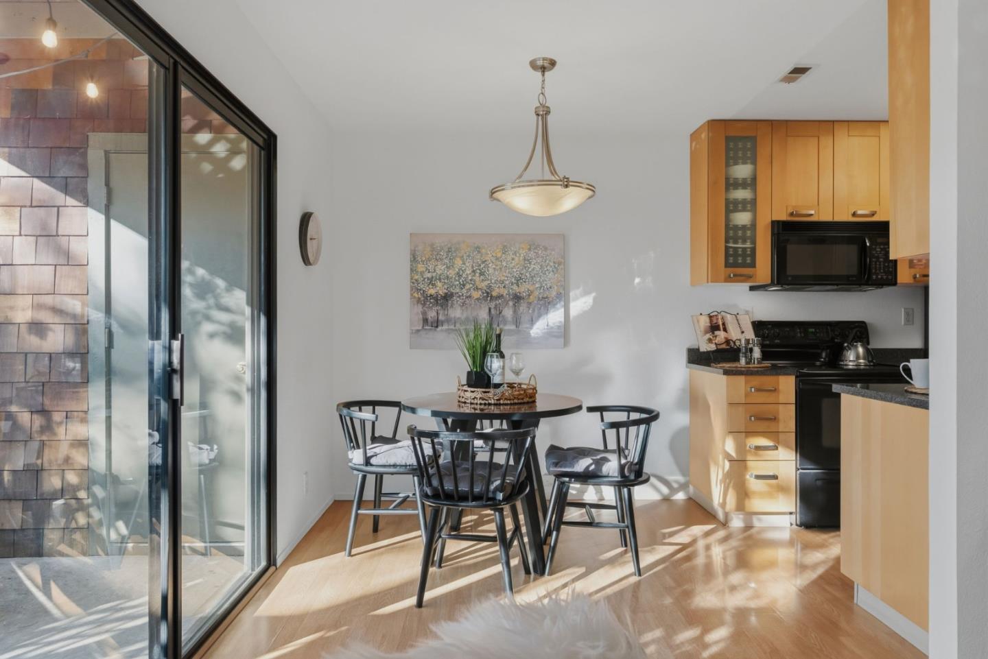 2106 La Terrace Circle San Jose, CA 95123 - Photo 9 of 31 a view of a dining room with furniture wooden floor a chandelier