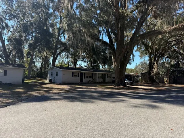 a view of street along with trees
