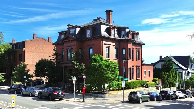 an aerial view of multiple houses with yard