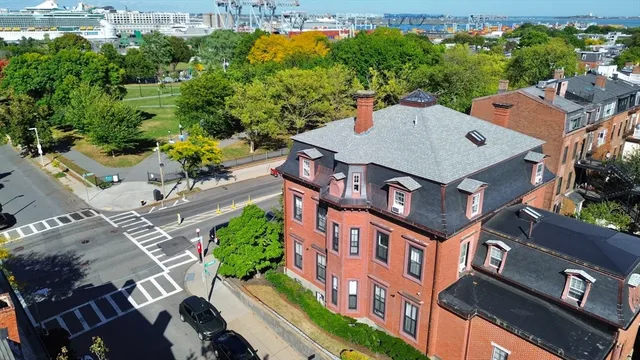 a view of a yard with cars