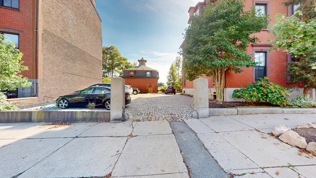 a view of a car parked on the side of a road