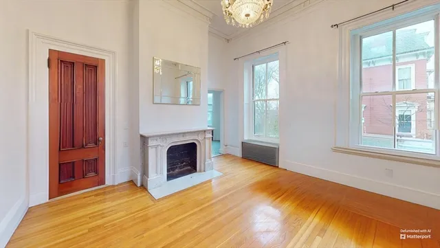 a bedroom with a bed and a fireplace