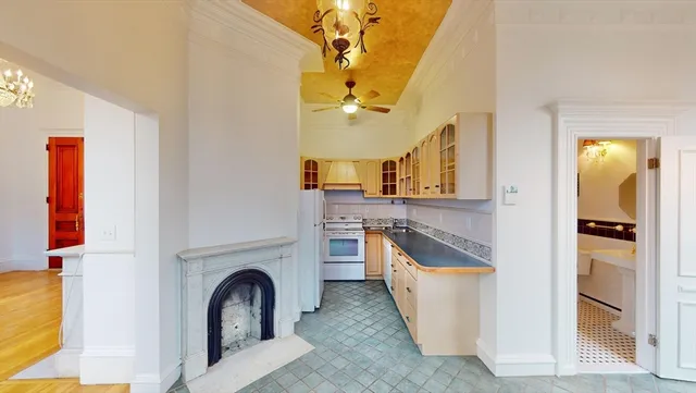 a view of a kitchen cabinets and a fireplace
