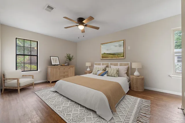 a bedroom with a large bed and a window