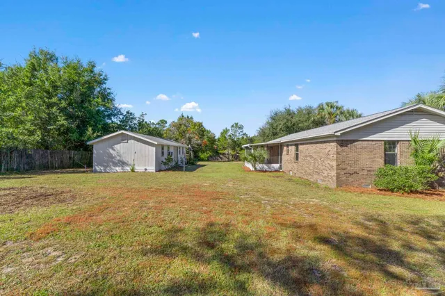 a house with trees in the background