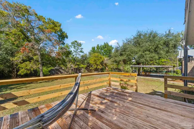 a view of a swimming pool with a lounge chair