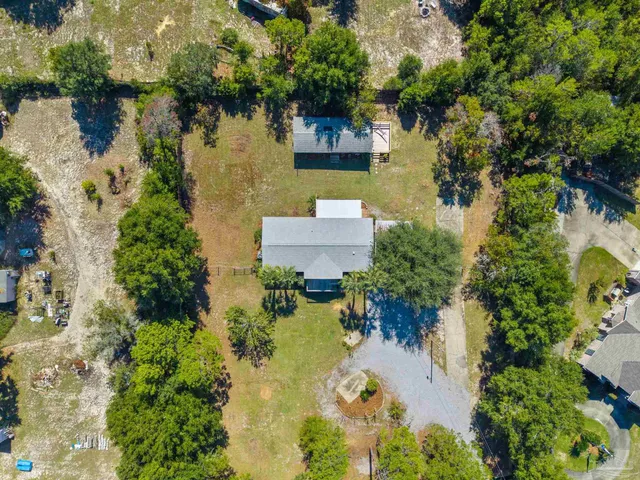 an aerial view of a house with a lake view