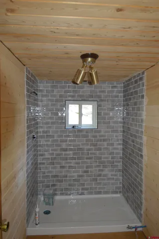 a view of a balcony with yard