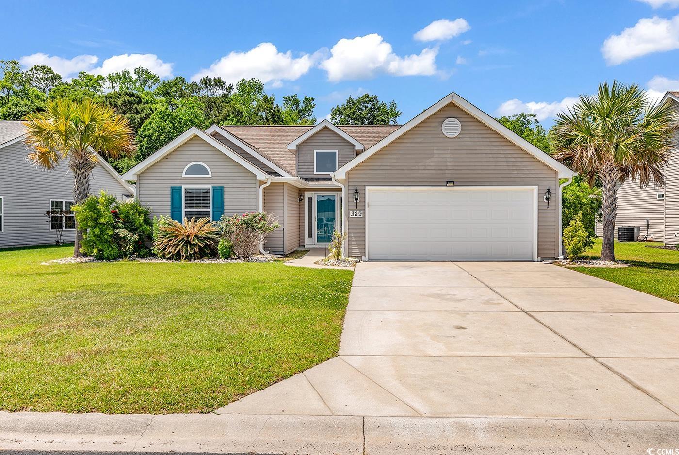 View of front of house featuring an attached garag