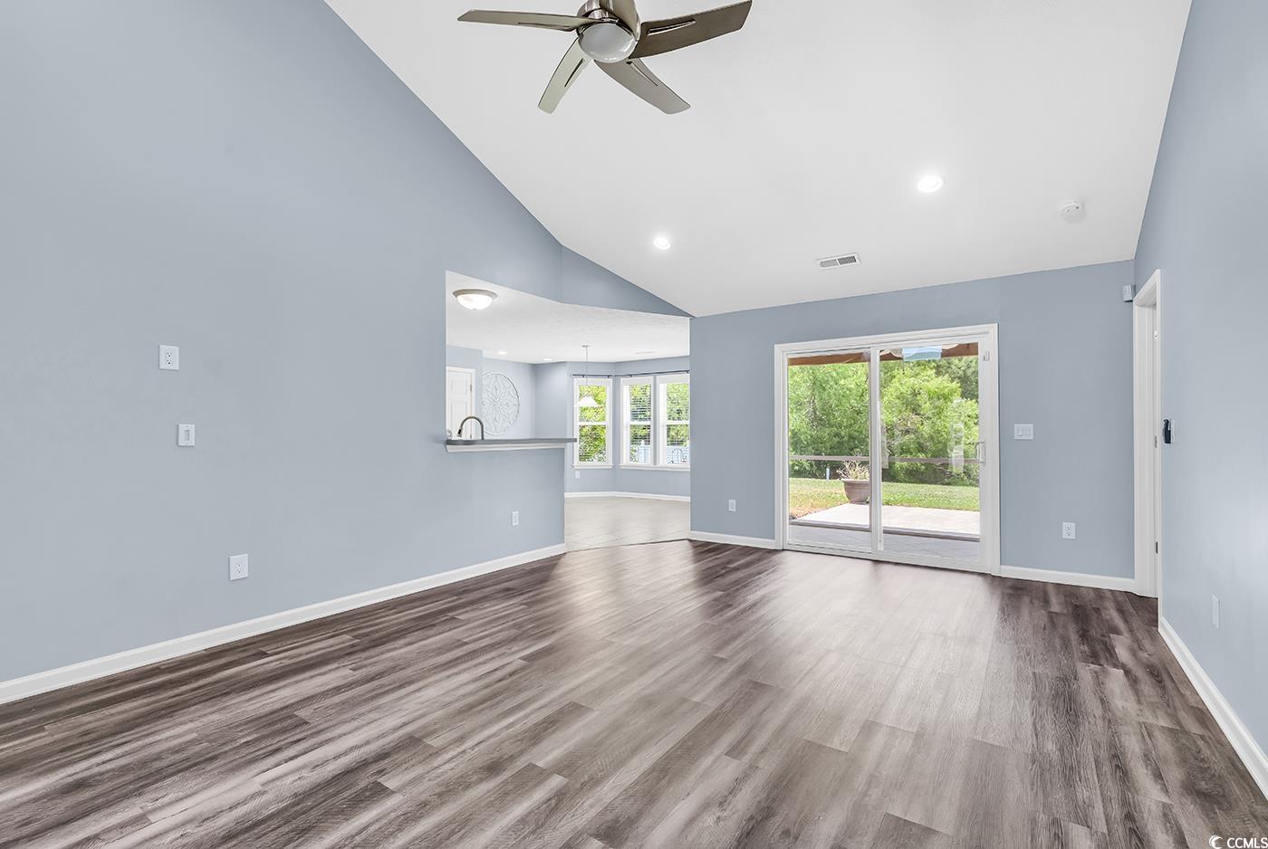 389 Barton Loop Myrtle Beach, SC 29579 - Photo 12 of 40 Unfurnished living room featuring high vaulted cei