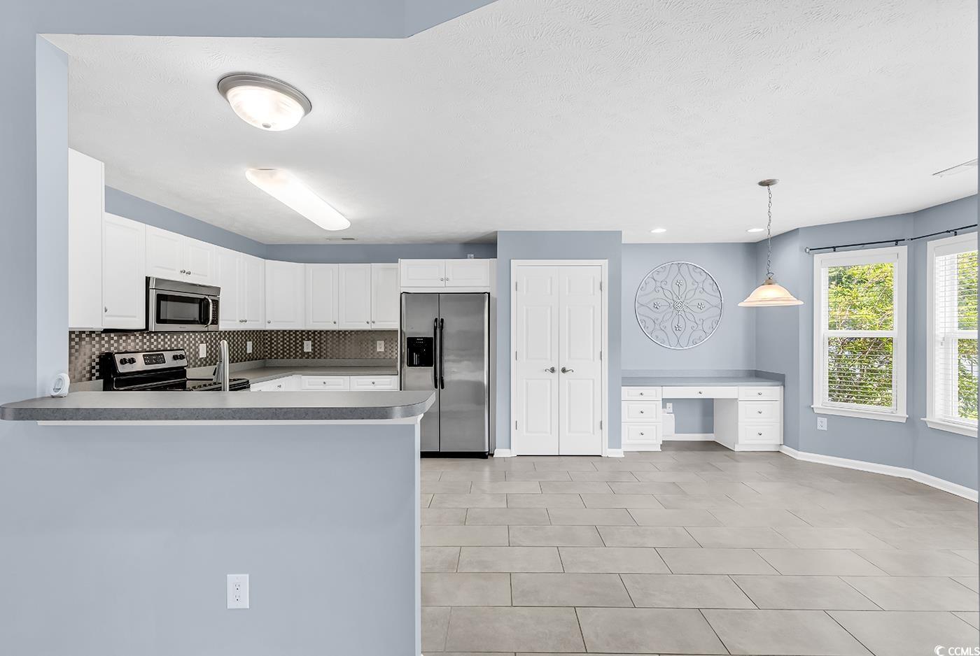 389 Barton Loop Myrtle Beach, SC 29579 - Photo 14 of 40 Kitchen with stainless steel appliances, baseboard