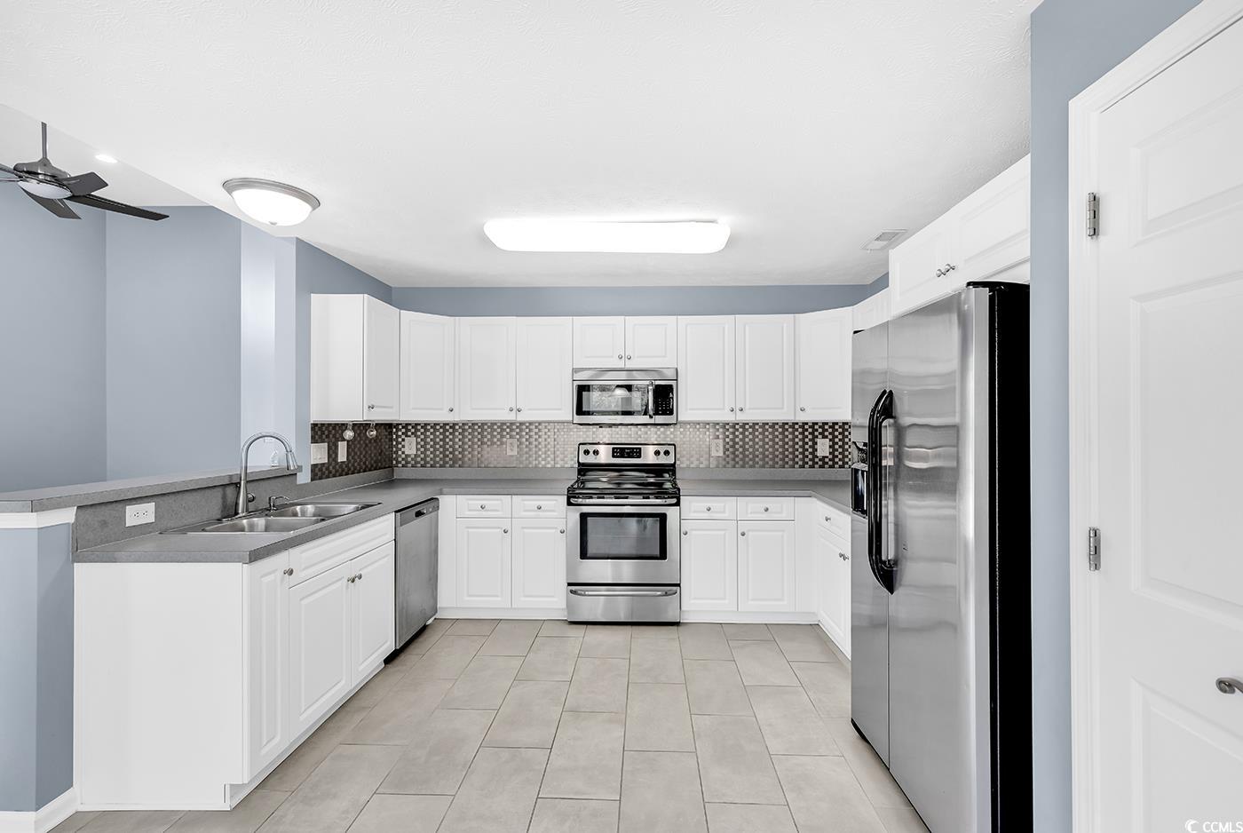 389 Barton Loop Myrtle Beach, SC 29579 - Photo 18 of 40 Kitchen with ceiling fan, appliances with stainles