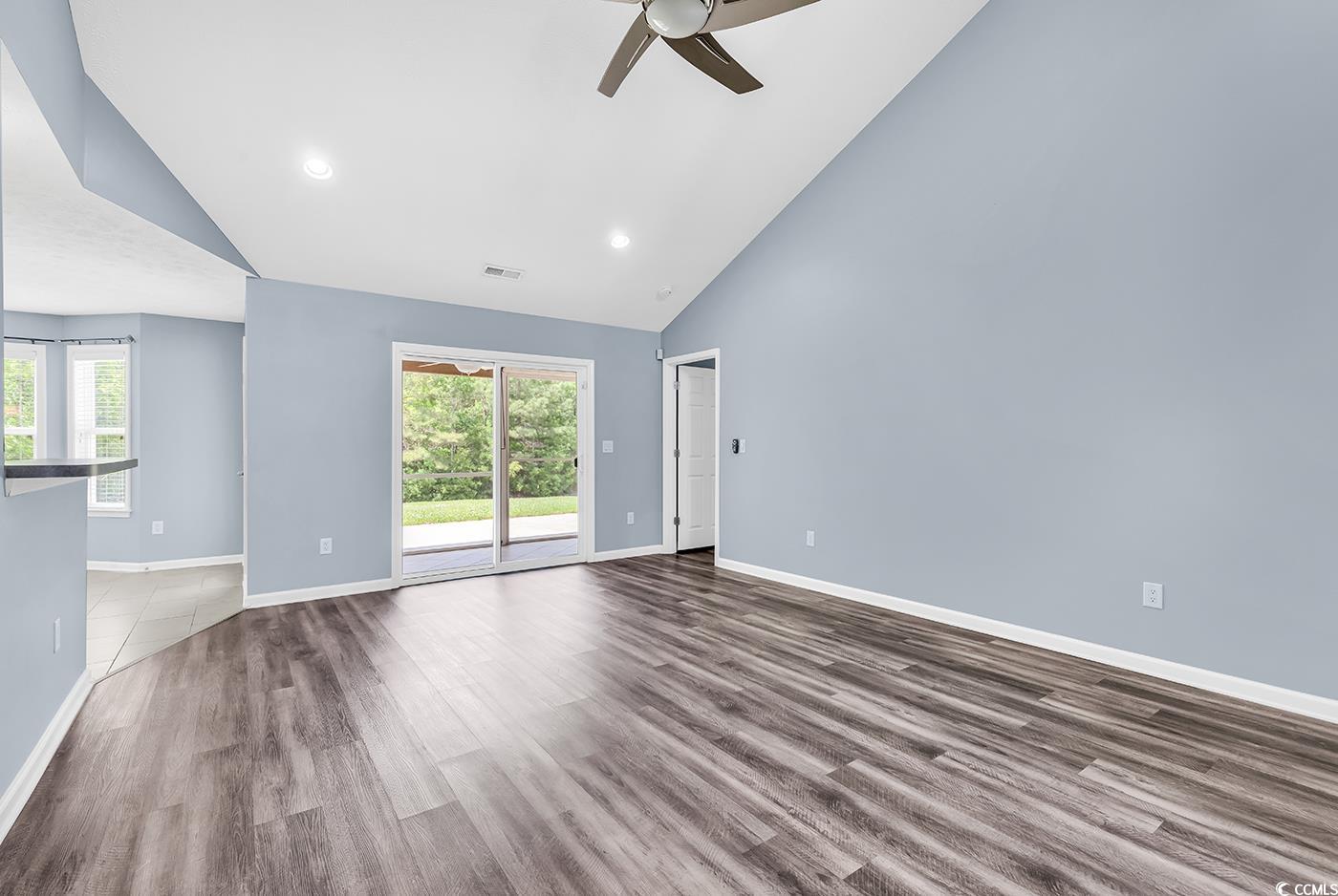 389 Barton Loop Myrtle Beach, SC 29579 - Photo 21 of 40 Unfurnished living room with high vaulted ceiling,