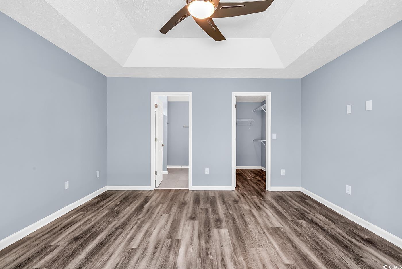 389 Barton Loop Myrtle Beach, SC 29579 - Photo 23 of 40 Unfurnished bedroom with baseboards, a tray ceilin