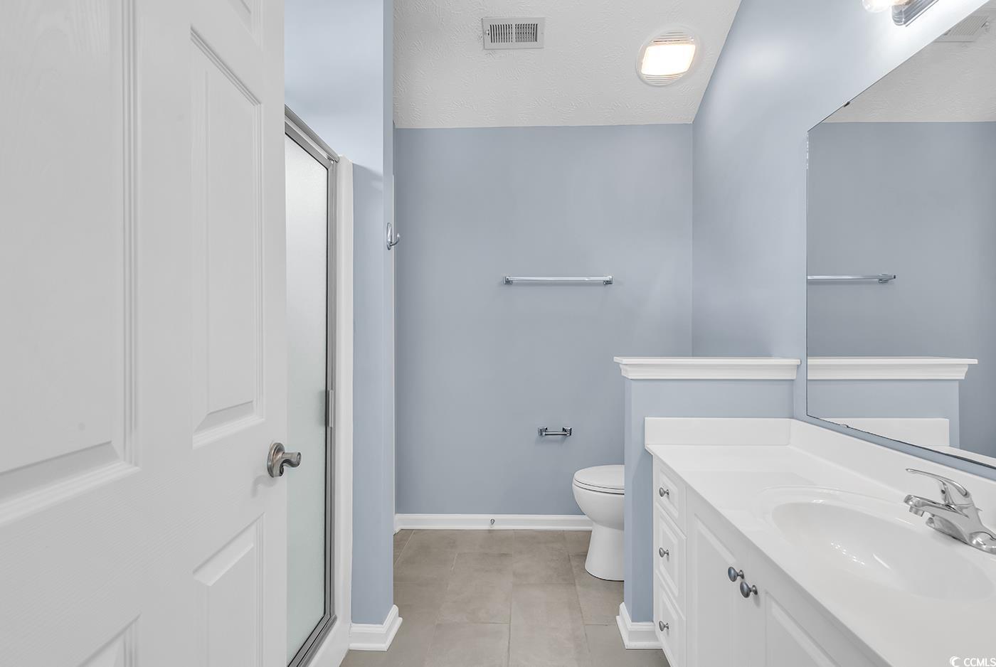 389 Barton Loop Myrtle Beach, SC 29579 - Photo 26 of 40 Bathroom with vanity, toilet, baseboards, visible