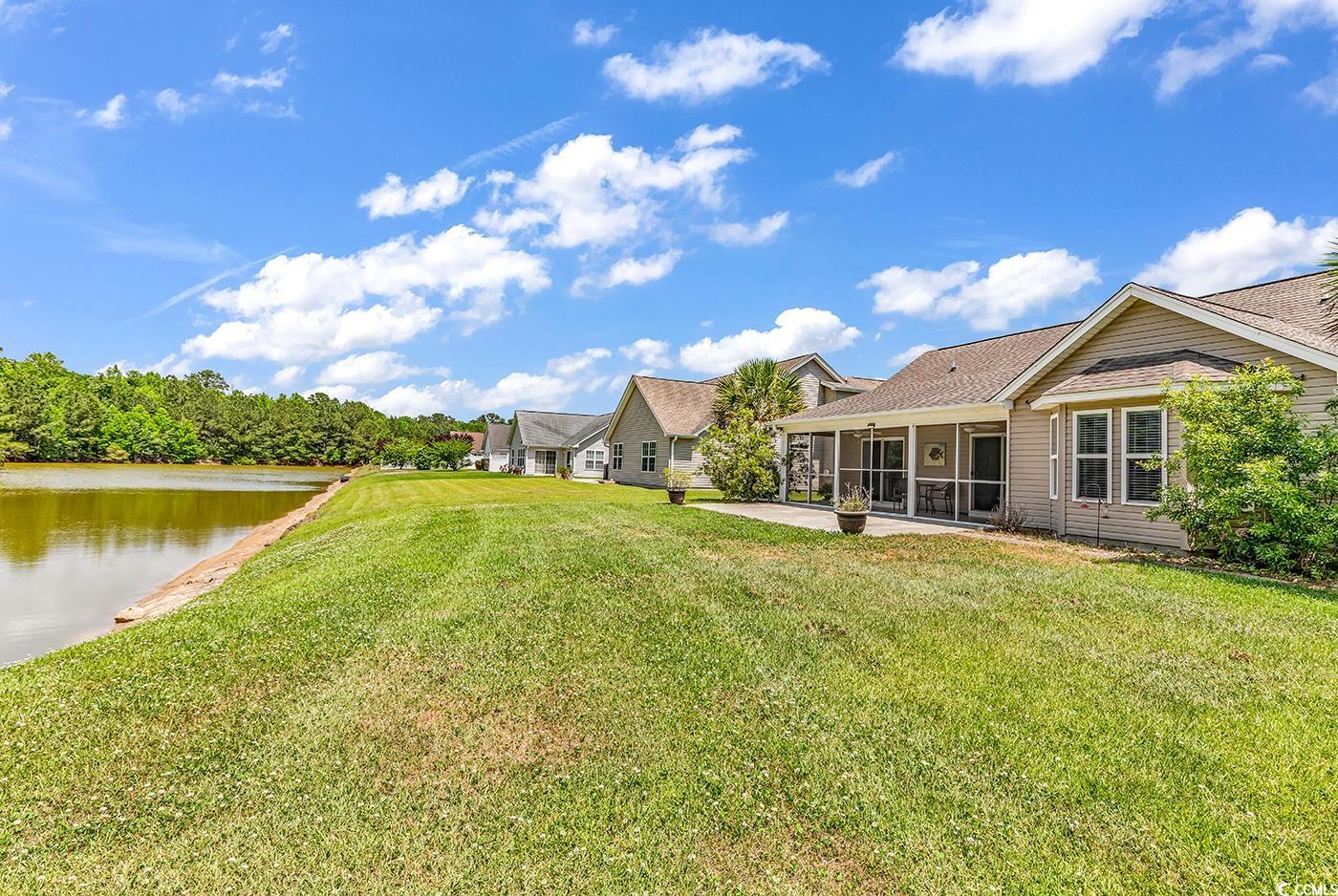 389 Barton Loop Myrtle Beach, SC 29579 - Photo 31 of 40 View of yard featuring a sunroom and a water view
