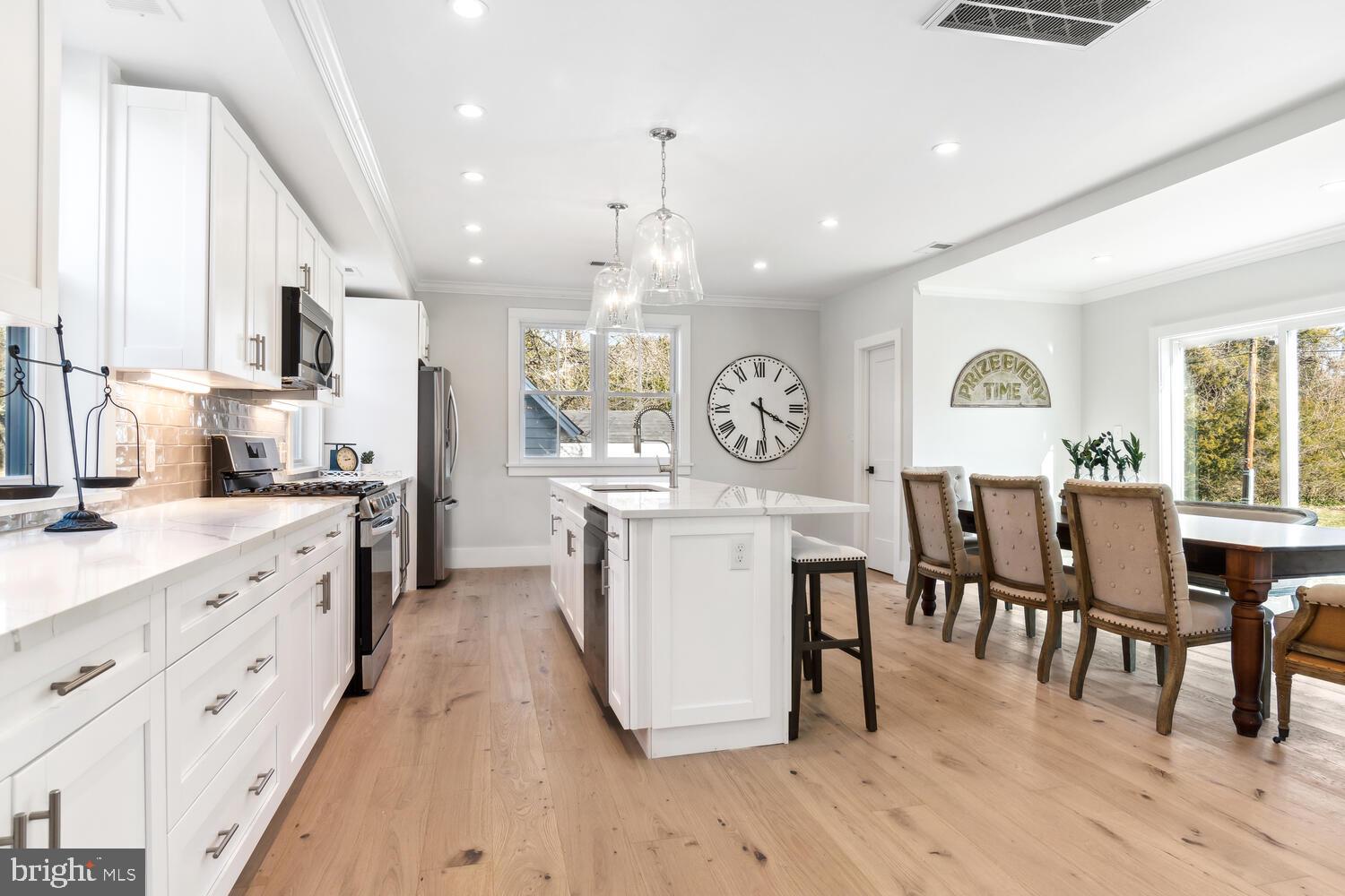 8013 Ruby Harrison Road St. Michaels, MD 21663 - Photo 11 of 47 a kitchen with furniture wooden floor and a window