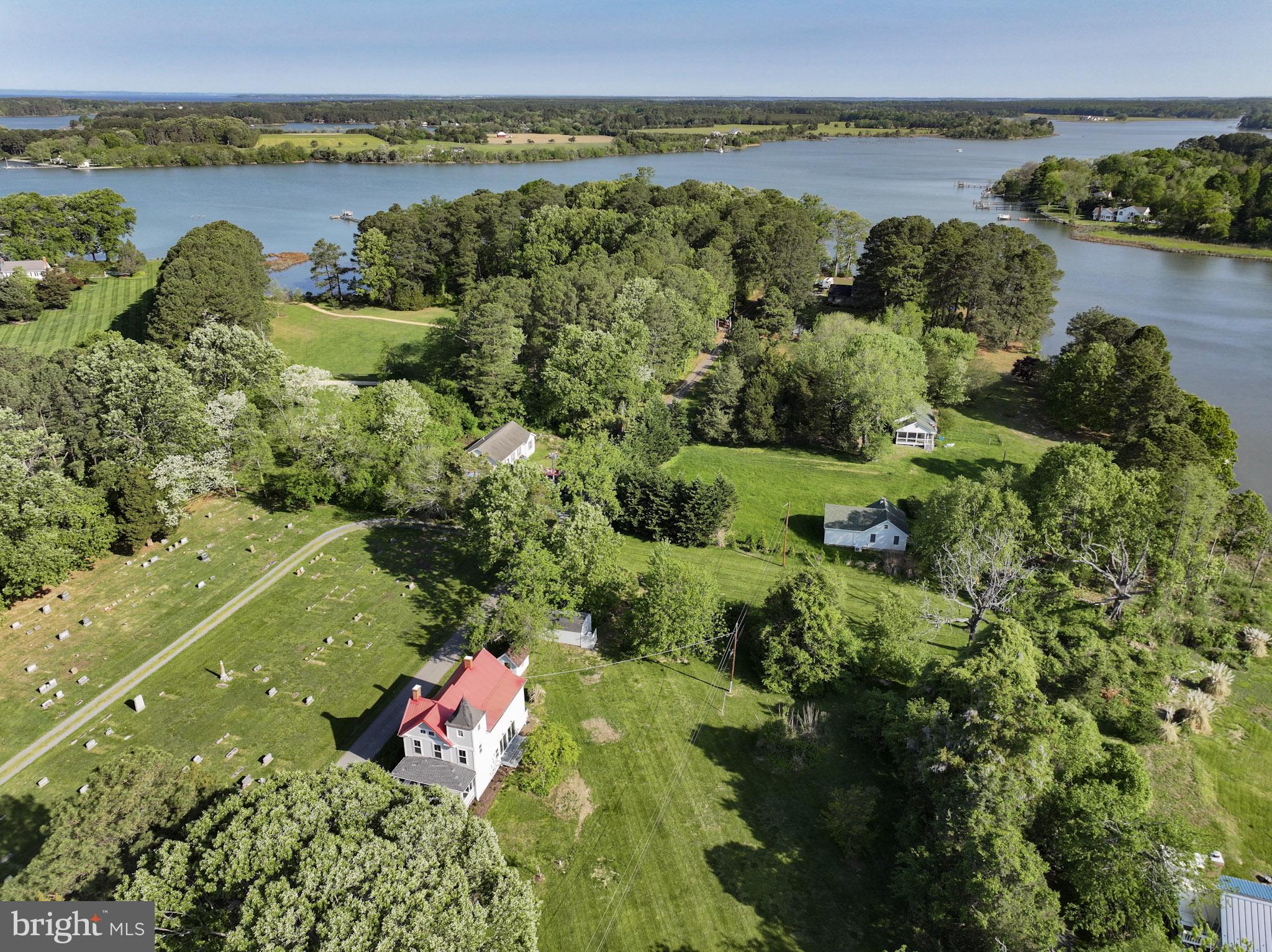 8013 Ruby Harrison Road St. Michaels, MD 21663 - Photo 2 of 47 an aerial view of residential houses with outdoor space and lake view
