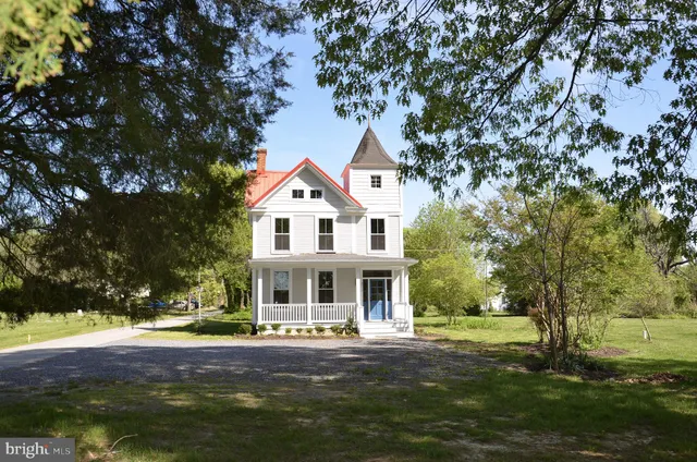 a front view of a house with a porch