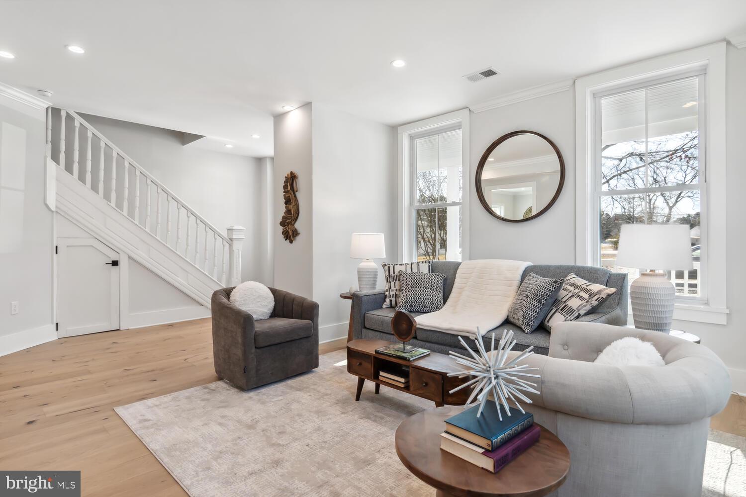 8013 Ruby Harrison Road St. Michaels, MD 21663 - Photo 9 of 47 a living room with furniture a wooden floor and a window