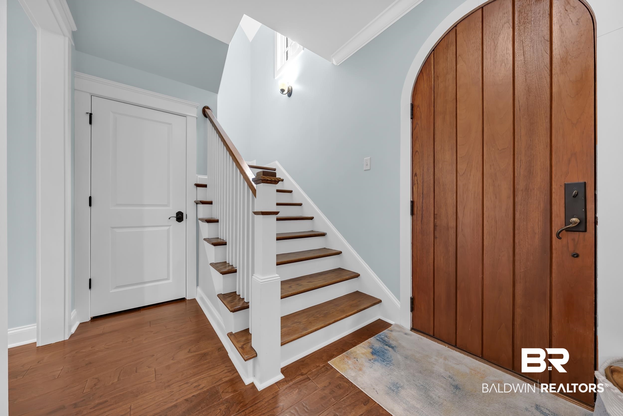 7 Bienville Avenue Mobile, AL 36606 - Photo 4 of 32 Stairs with wood finished floors, arched walkways, and ornamental molding