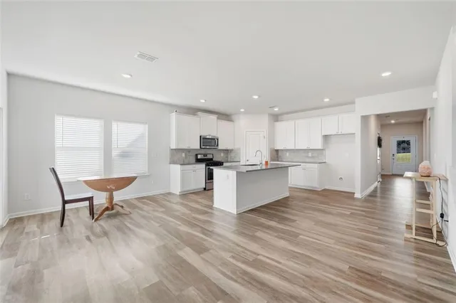 a living room with furniture fireplace and a flat screen tv