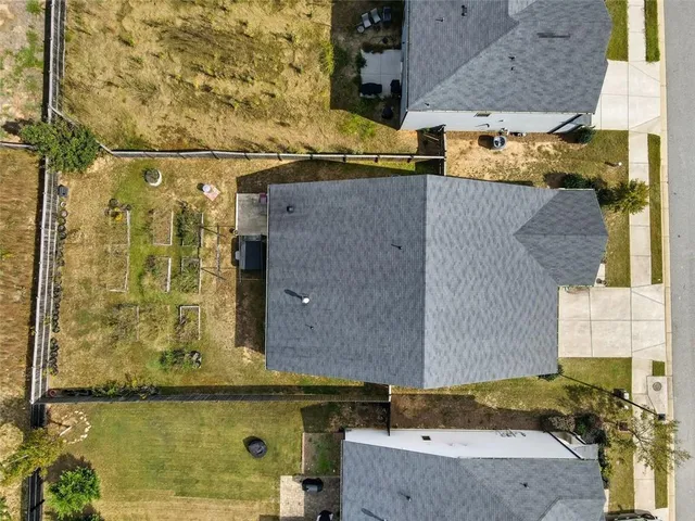 a view of a chair and table in the garden