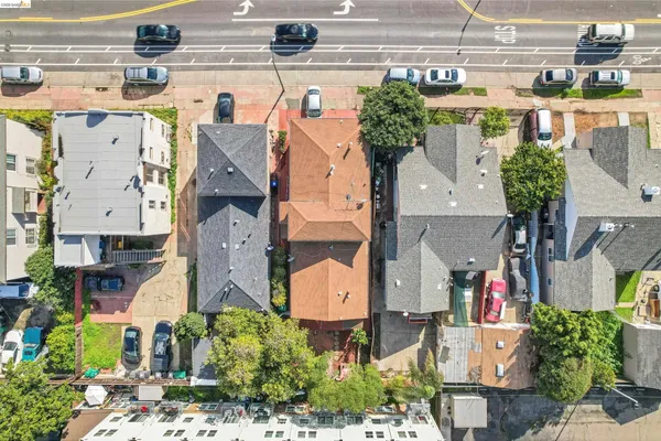 an aerial view of houses with outdoor space