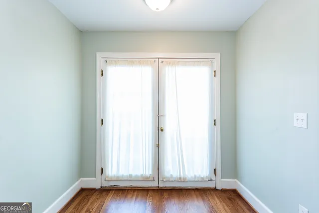 a view of front door with wooden floor