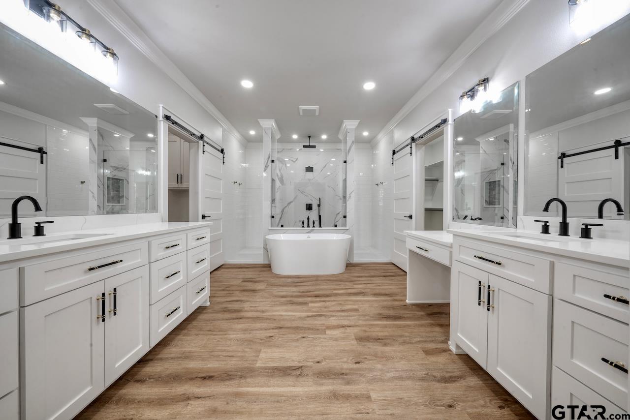 19383 Ridge Point Circle Lindale, TX 75771 - Photo 26 of 48 a large bathroom with double sink and a large mirror