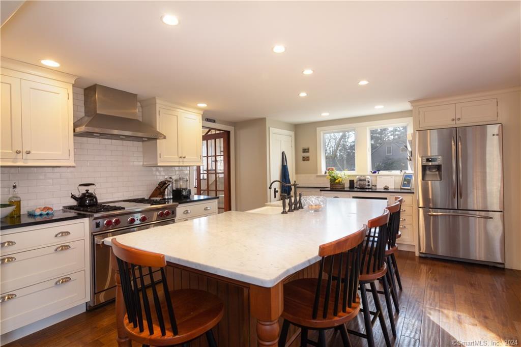 323 Green Hill Road Madison, CT 06443 - Photo 4 of 18 The oversized island is perfect for gatherings.