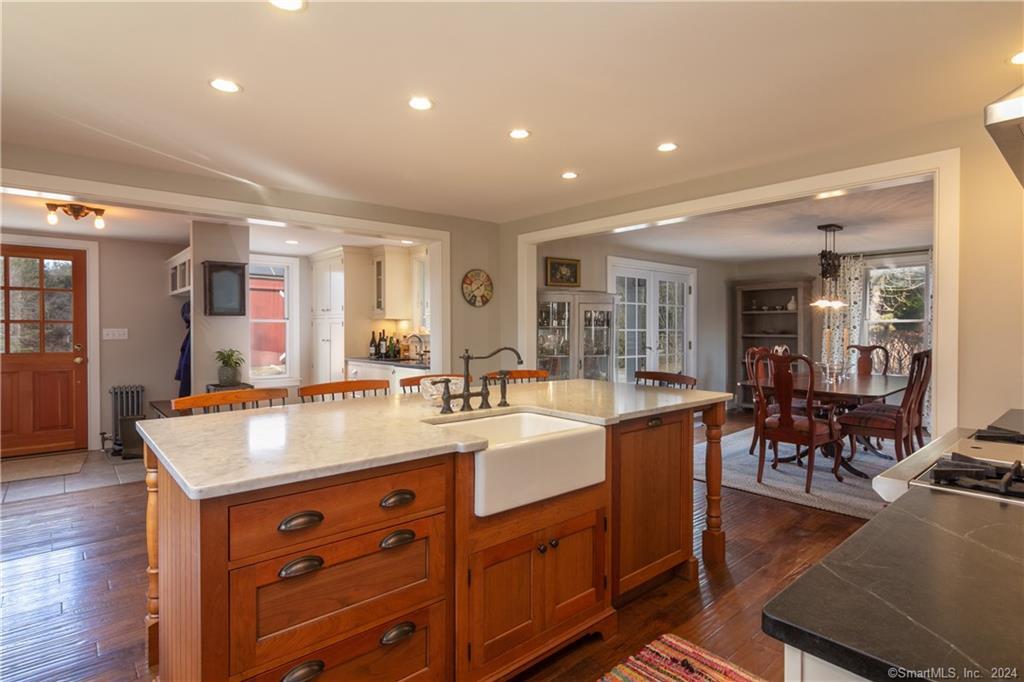 323 Green Hill Road Madison, CT 06443 - Photo 6 of 18 Nook offers a Bar area, Dining Room to the right.
