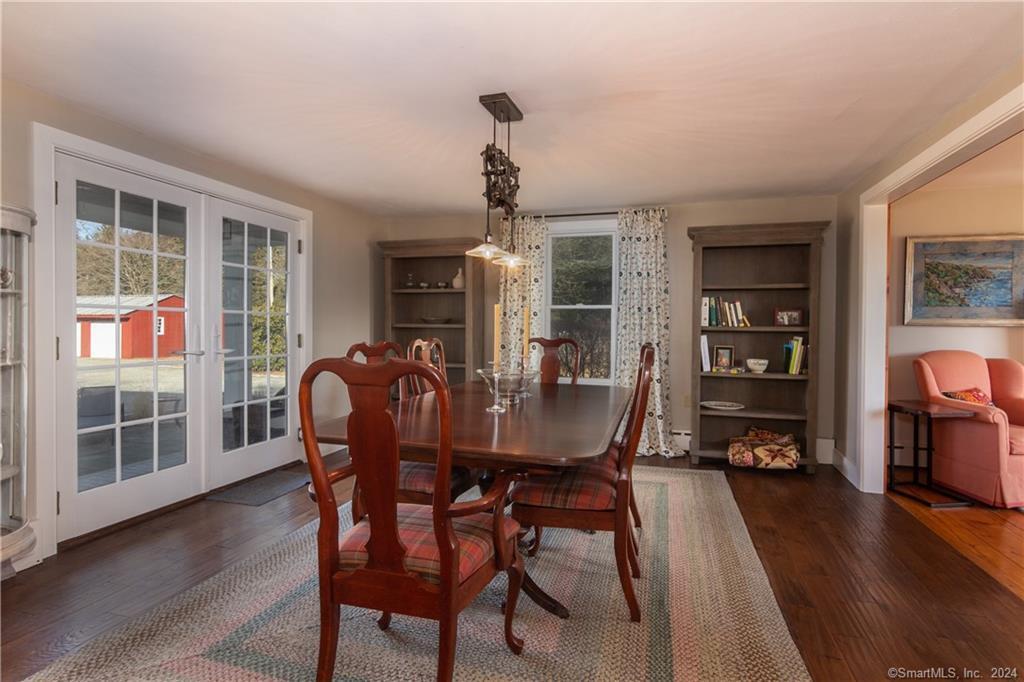 323 Green Hill Road Madison, CT 06443 - Photo 7 of 18 The Dining Room with access to deck and patio via French doors to the left.